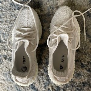 Size 8.5 men’s white Yeezy worn twice.